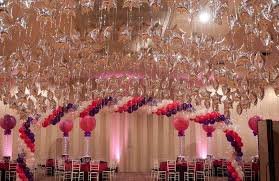 How do I get 100 balloons to stay in place hanging over the dance floor